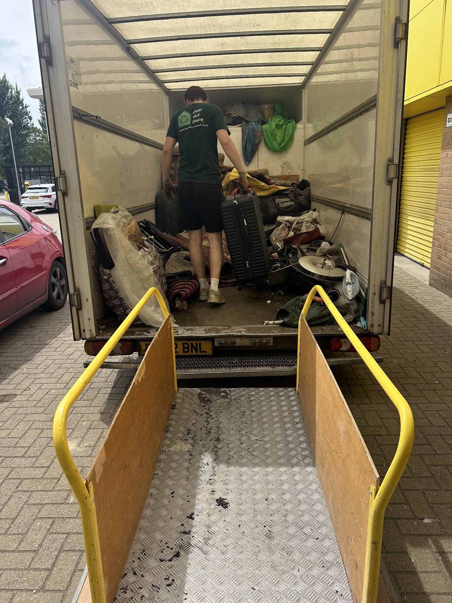 Waste and items secured on the van, ready for licensed disposal